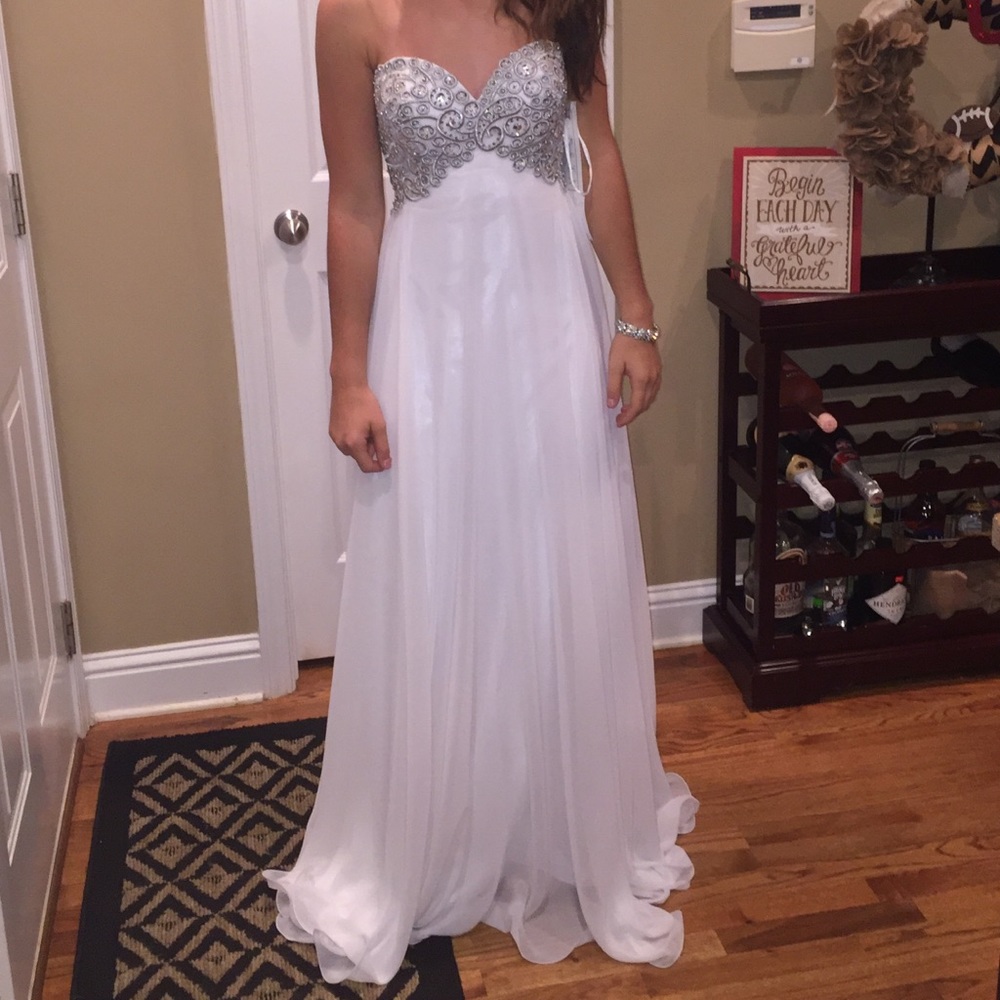 White and silver full length strapless gown